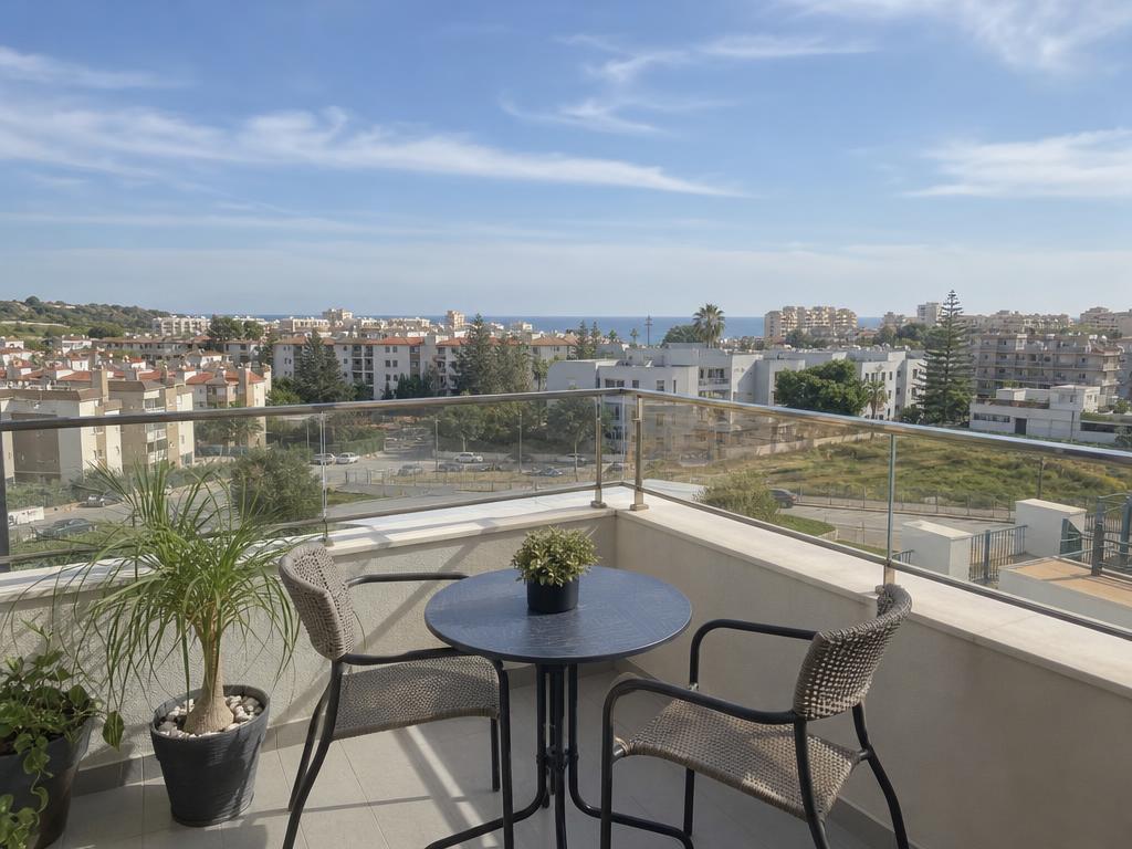Apartment terrace overlooking a coastal residential town on the Costa del Sol